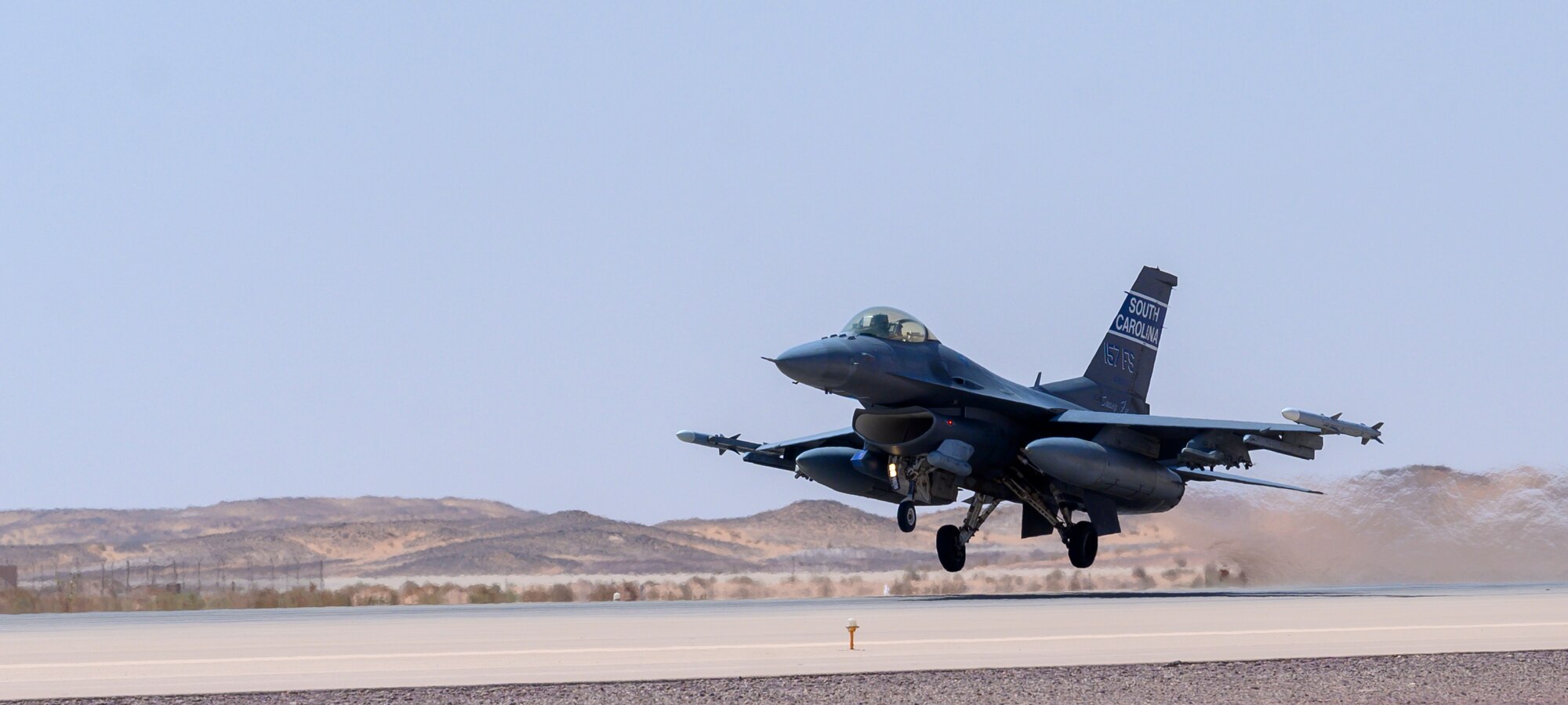 U.S. Air Force Maj. Taylor Blevins, 157th “Swamp Fox” Expeditionary Fighter Squadron pilot, takes flight in a U.S. Air Force Fighting Falcon F-16 during a training mission, Prince Sultan Air Base, Kingdom of Saudi Arabia, June 20, 2021. The 157th EFS is currently deployed to PSAB to bolster defensive capabilities against potential threats in the region. (U.S. Air Force photo by Senior Airman Samuel Earick)