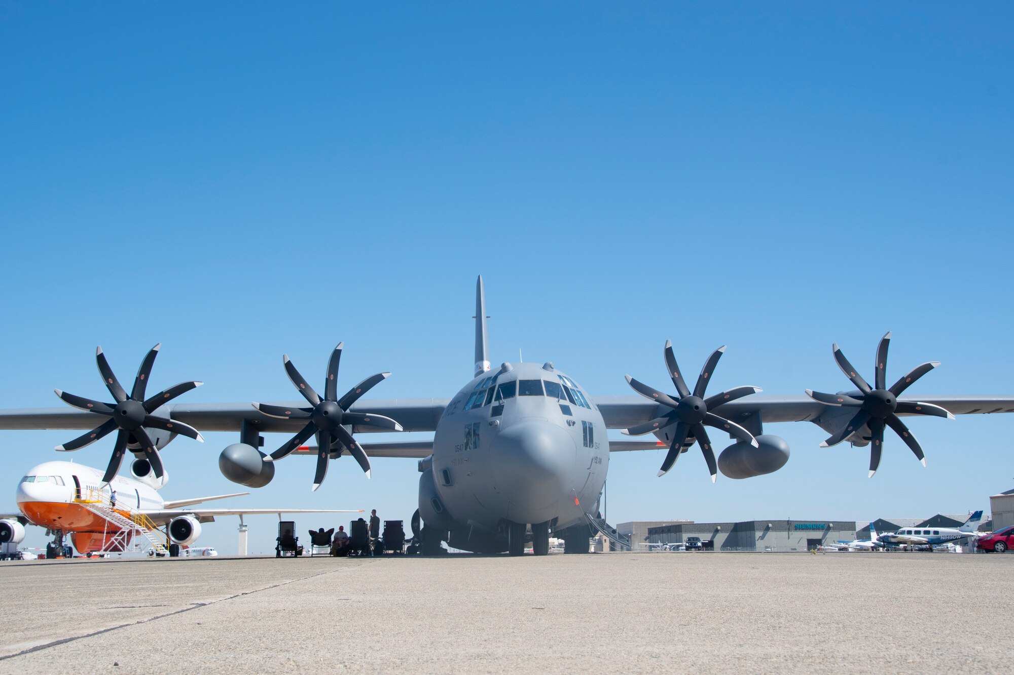 Nevada Air National Guard's 152nd Airlift Wing C-130 sits on the ramp at CAL FIRE’s McClellan Reload Base, Calif., during Modular Airborne Fire Fighting System training in June 2020. The aircrew practiced water drops in remote areas of the Tahoe National Forest and Shasta-Trinity National Forest.
