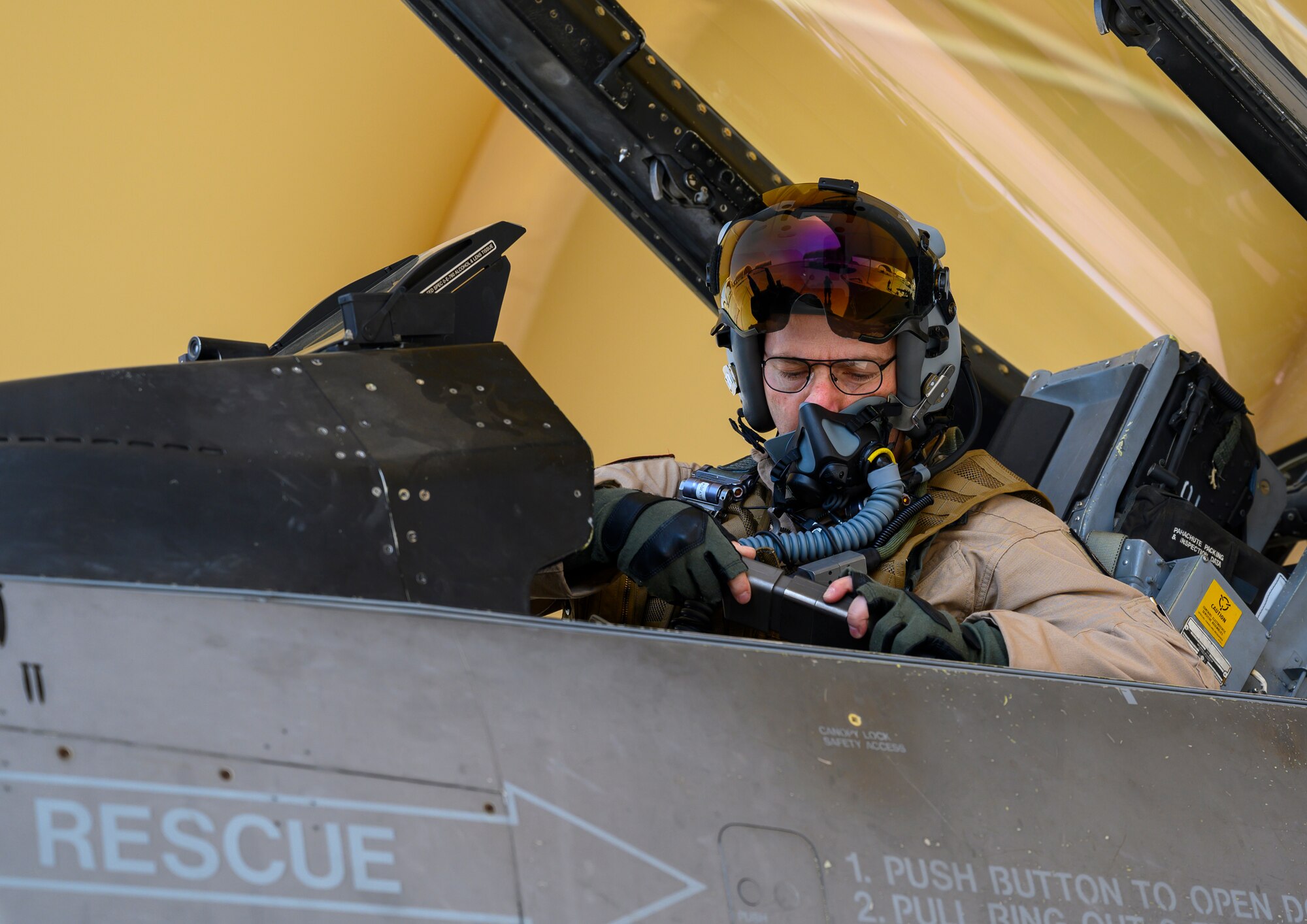 U.S. Air Force Brig. Gen. Robert Davis, 378th Air Expeditionary Wing commander, prepares for his flight in a U.S. Air Force F-16 Fighting Falcon, Prince Sultan Air Base, Kingdom of Saudi Arabia, June 20, 2021. Davis, a trained fighter pilot, flew a sortie with the 157th “Swamp Fox” Expeditionary Fighter Squadron, currently deployed to PSAB to bolster defensive capabilities against potential threats in the region. (U.S. Air Force photo by Senior Airman Samuel Earick)