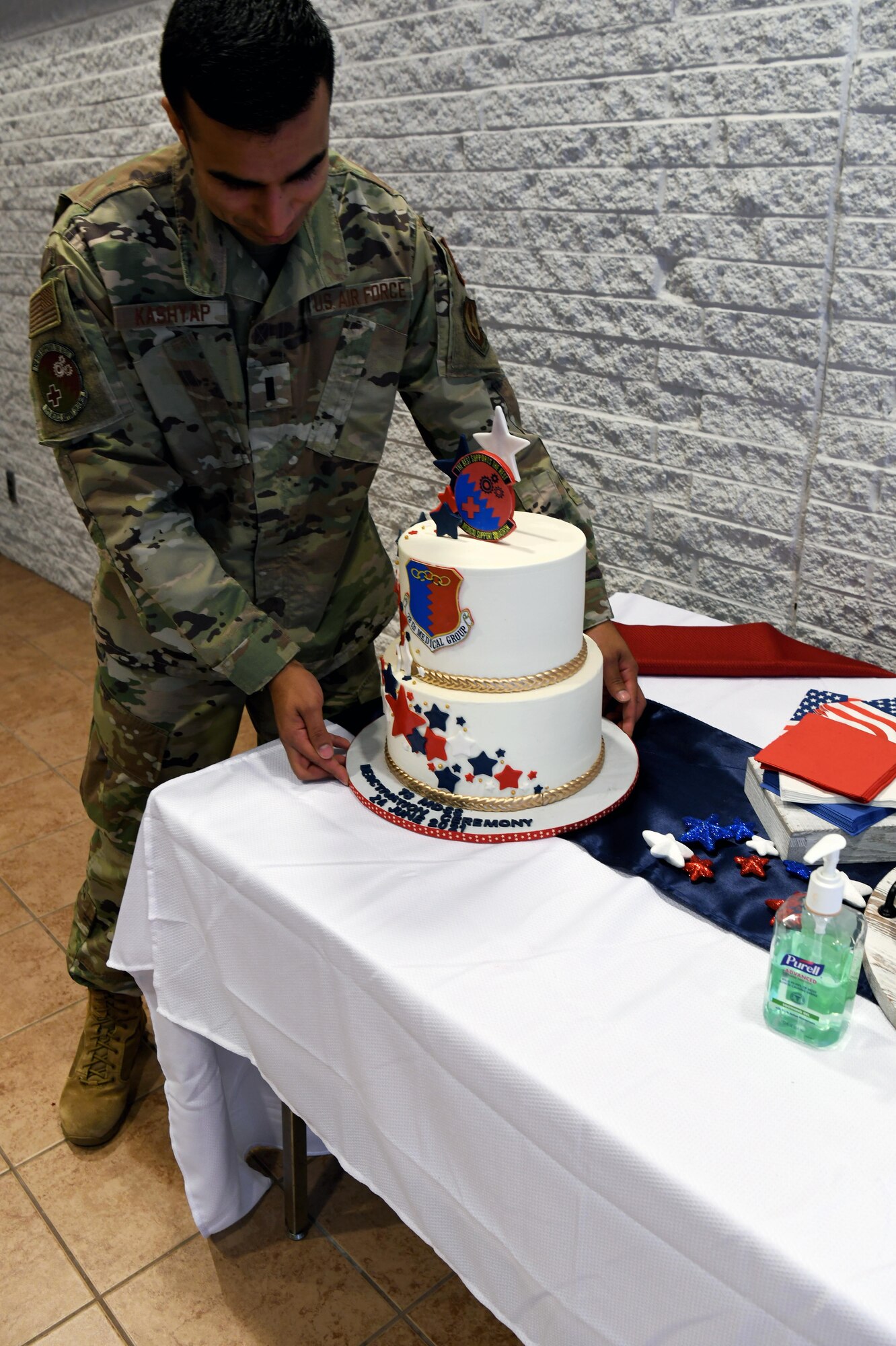 File shows Airman placing cake on table.
