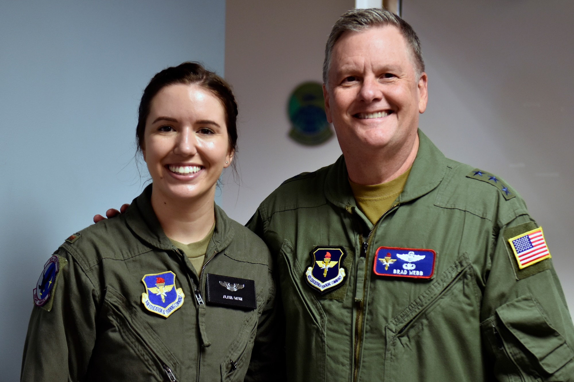 U.S. Air Force 2nd Lt. Alana Daum stands with Lt. Gen. Brad Webb, Air Education and Training Command commander, following her graduation from Specialized Undergraduate Helicopter Pilot Training, Class 21-05, at Fort Rucker, Alabama, June 22, 2021. Seven officers received their pilot’s wings, becoming the first Air Force officers to earn their wings from a helicopter-only syllabus since 1993. HTN is one initiative of the Pilot Training Transformation effort and was developed to create quality pilots, while increasing the Air Force’s overall pilot production. The HTN graduates began their training August 2020 as part of a small group who went directly to Fort Rucker for TH-1 training. HTN is one aspect of the AETC Pilot Training Transformation efforts that include Undergraduate Pilot Training 2.5, Accelerated Path to Wings, Remote SIM Instruction, Civil Path to Wings and Alternate Path to Wings.