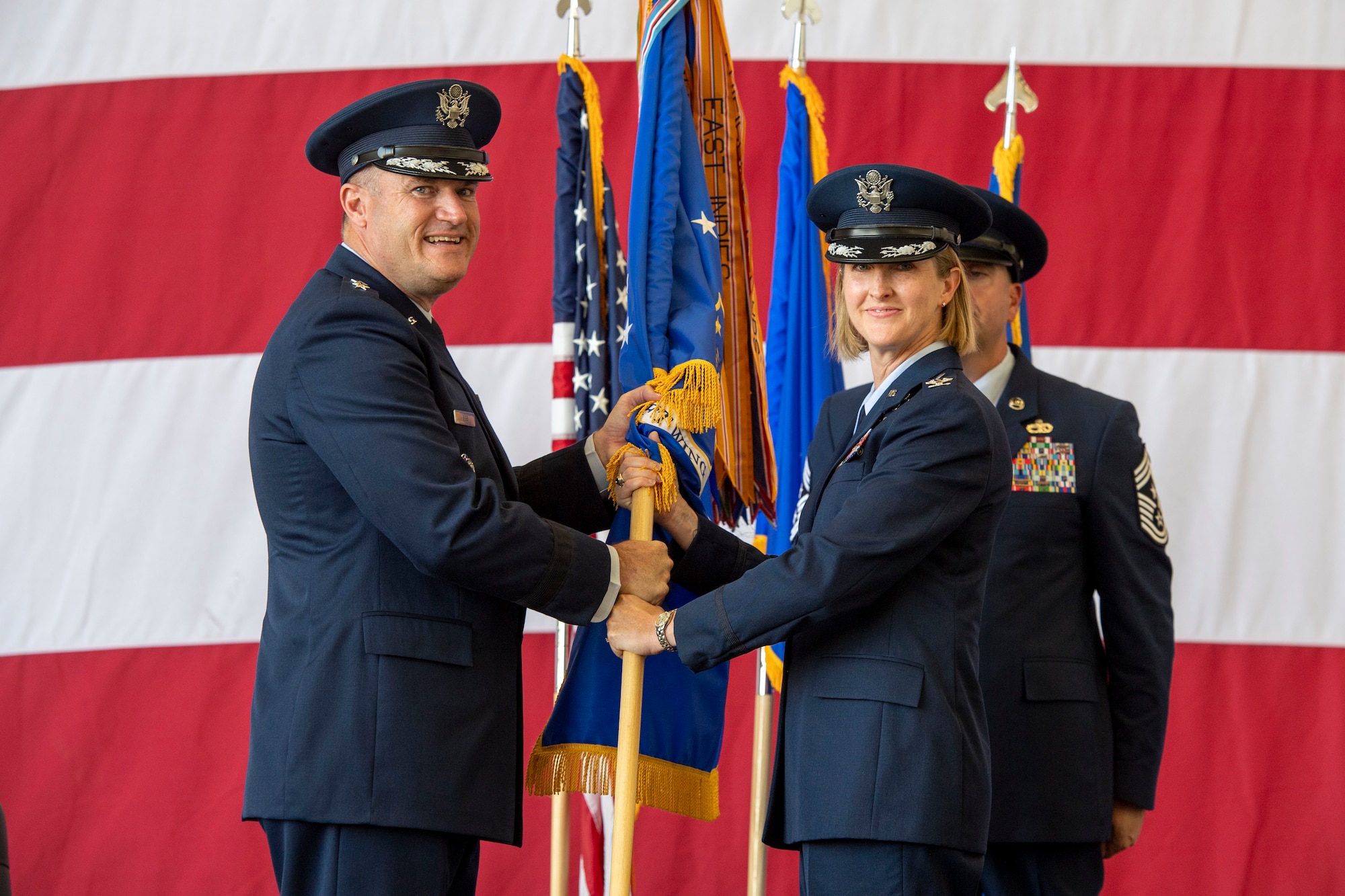 A guidon is passed during a change of command ceremony.