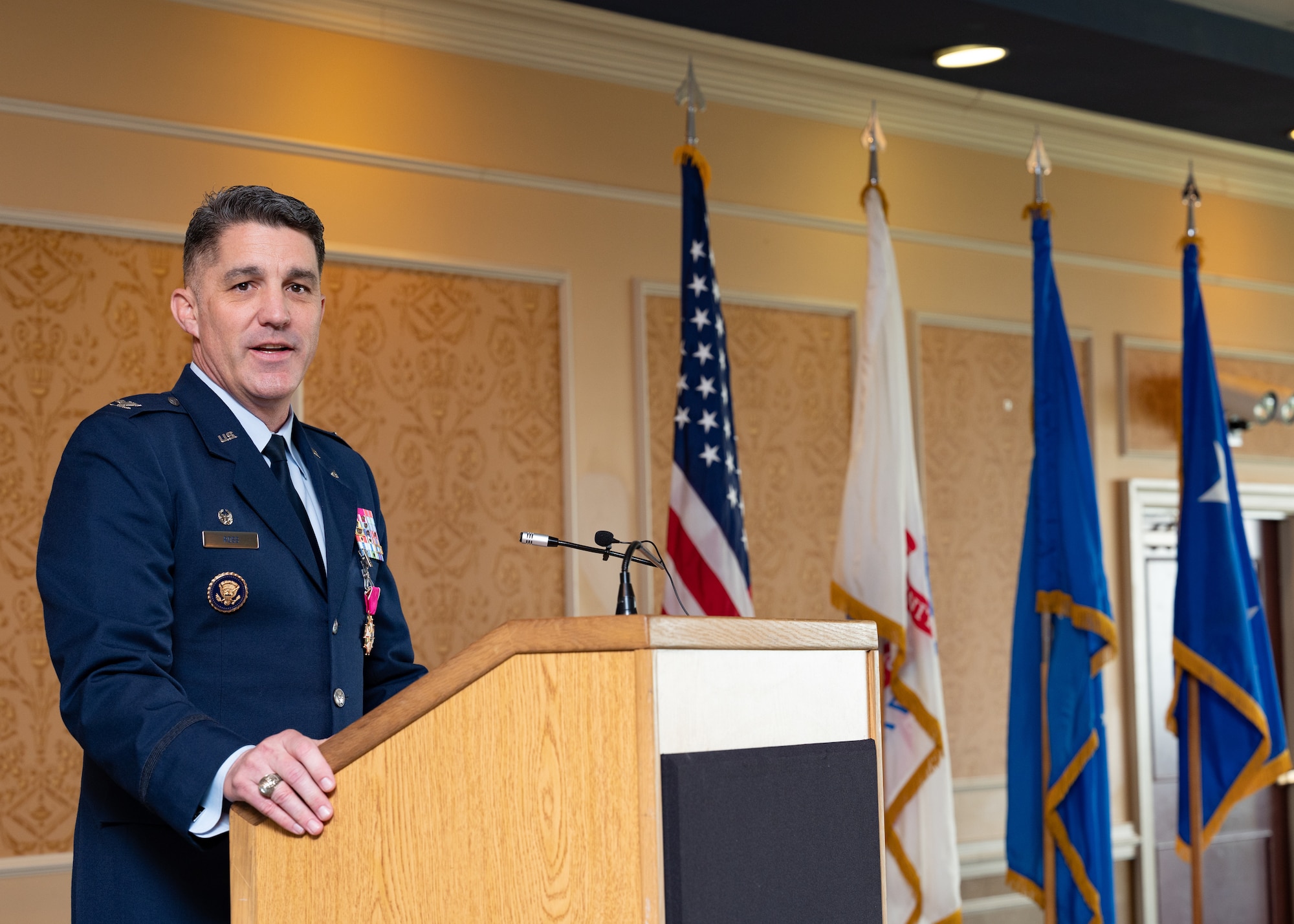 U.S. Air Force Col. Clint Ross, outgoing 633d Air Base Wing commander, delivers remarks during a change of command ceremony at Joint Base Langley Eustis, June 25, 2021. Ross thanked his family and all members of the 633d ABW for their service and commitment to the mission.