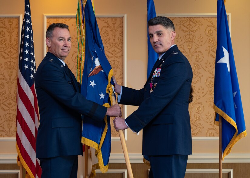 U.S. Air Force Col. Clint Ross, outgoing 633d Air Base Wing commander, relinquishes command to U.S. Air Force Maj. Gen. Chad P. Franks, 15th Air Force commander, during a change of command ceremony at Joint Base Lan gley Eustis, June 25, 2021. Franks commended Ross on his success as a commander and thanked him for his service.