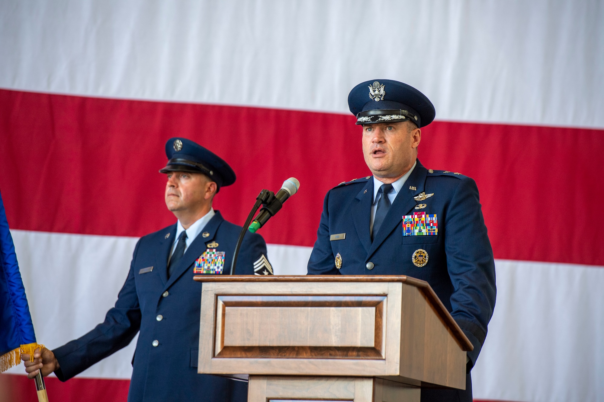 An Airman speaks during a change of command ceremony.