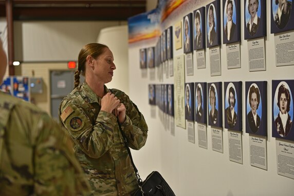 U.S. Air Force Lt. Col. Kara Taylor, 17th Comptroller Squadron commander, reads the 38 Memorial Wall at the National Women Airforce Service Pilots World War II Museum in Sweetwater, Texas, June 24, 2021. The 38 Memorial Wall commemorates the 38 women who lost their lives during service ranging from 1943 to 1944. (U.S. Air Force photo by Senior Airman Ashley Thrash)