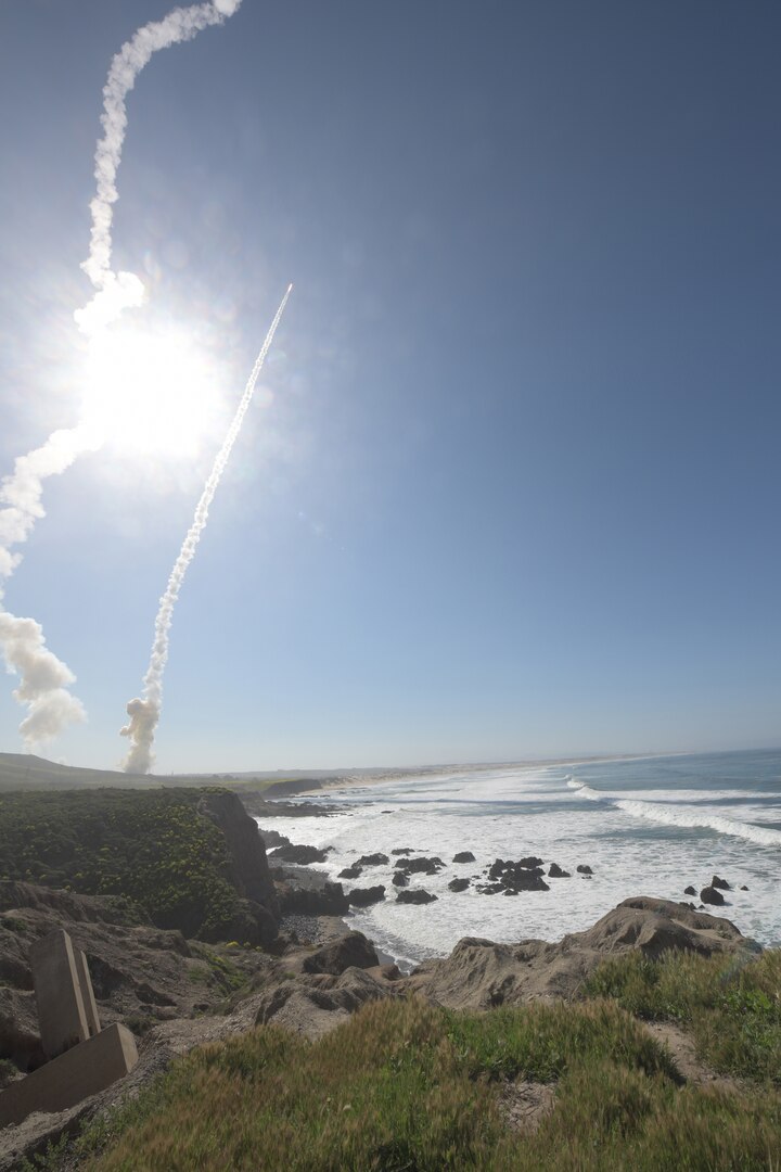 Missiles launch into the sky.