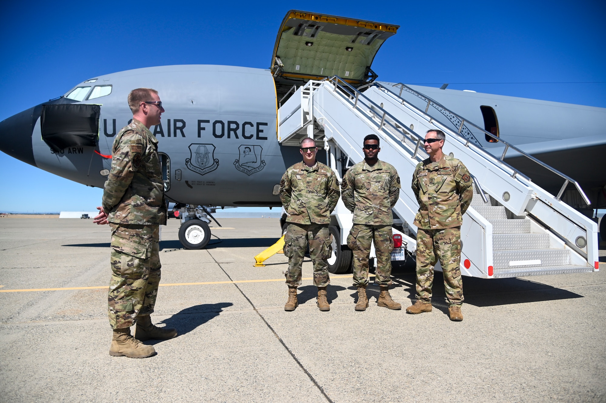 (left to right) Tech. Sgt. Curtis T. Gentry, 940th Aircraft Maintenance Squadron dedicated crew chief, along with Staff Sgt. Dane Hagbom, 940 AMXS assistant crew chief, and Senior Airman Kemari Williamson, 940 AMXS crew chief, tells Maj. Gen. Jeffrey Pennington about their decision for the KC-135 Stratotankers nose artwork June 13, 2021, at Beale Air Force Base California.