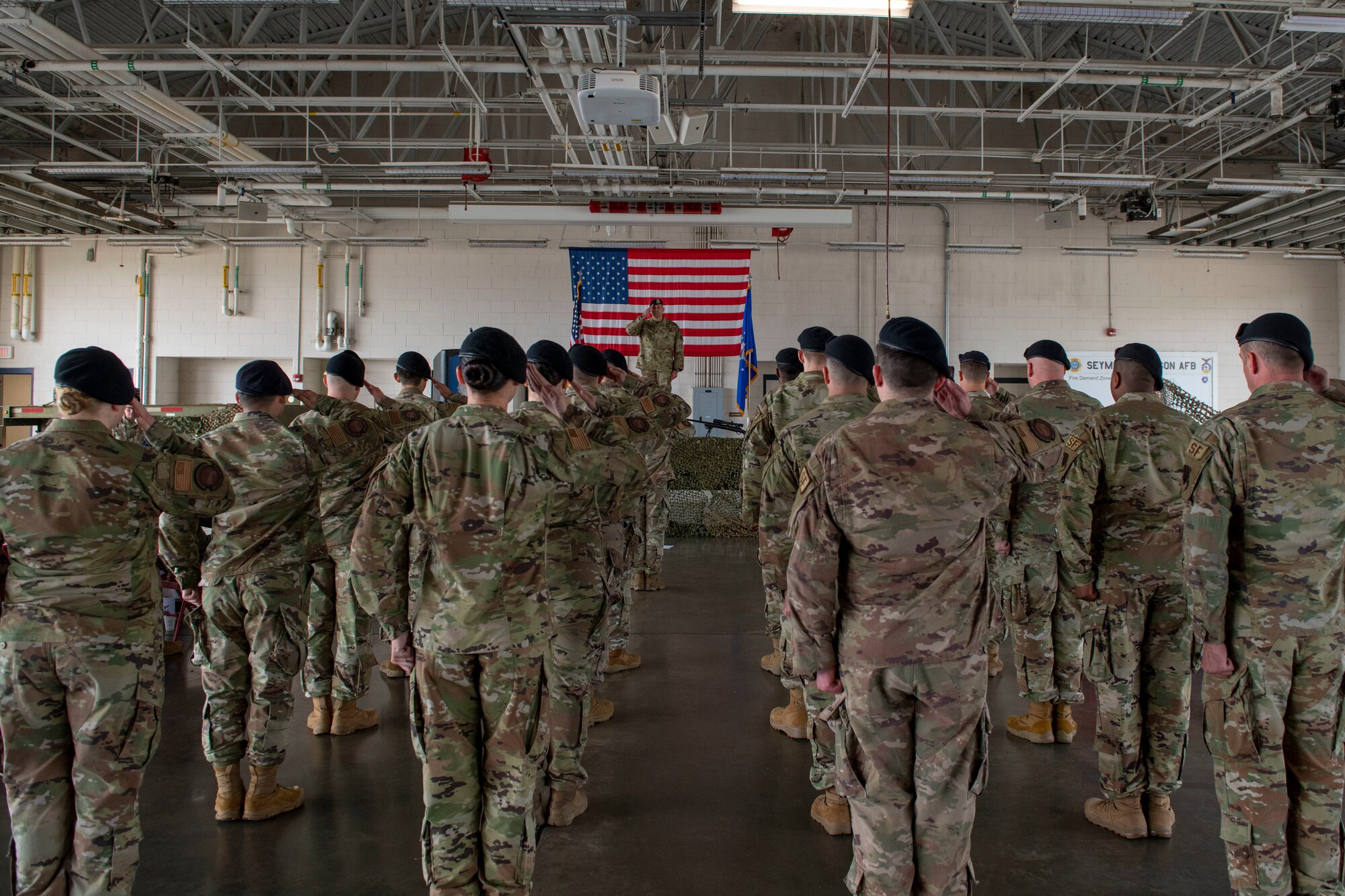 Maj. Michael Wetlesen, center, incoming 4th Security Forces Squadron commander, renders his first salute to his squadron after accepting command of the 4th SFS during an assumption of command ceremony at Seymour Johnson Air Force Base, North Carolina, April 9, 2021.