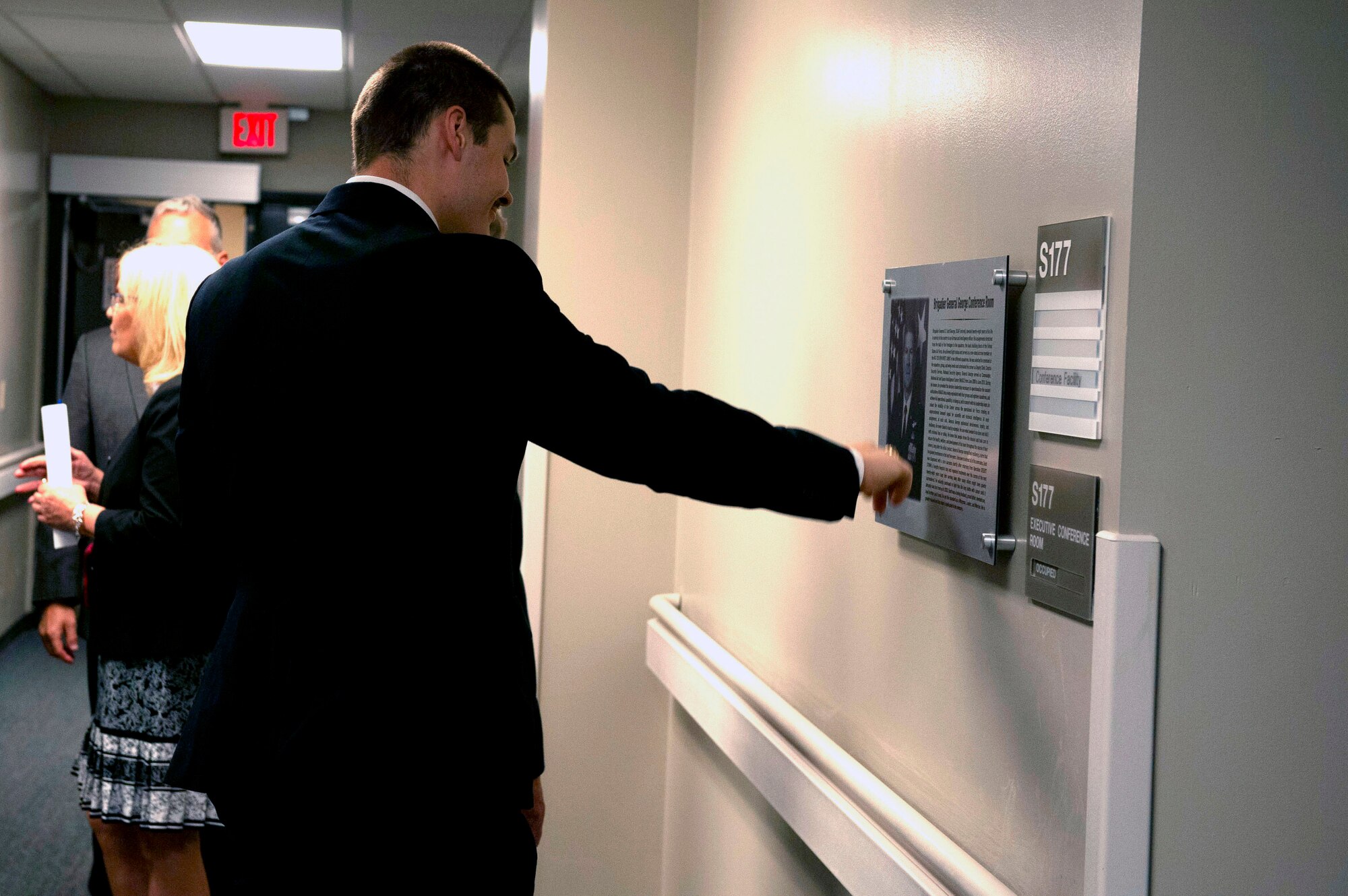 National Air and Space Intelligence Center leadership memorialized Brigadier General D. Scott George with the dedication of a conference room bearing his name at Wright-Patterson Air Force Base, Ohio, May 21, 2021. George, who passed away June 28, 2020, served as the NASIC commander from June 2008 to June 2010 and retired from service as the Deputy Director of the National Security Agency after nearly 30 years of distinguished and devoted service to his country. (U.S. Air Force photo by Senior Airman Caleb House)