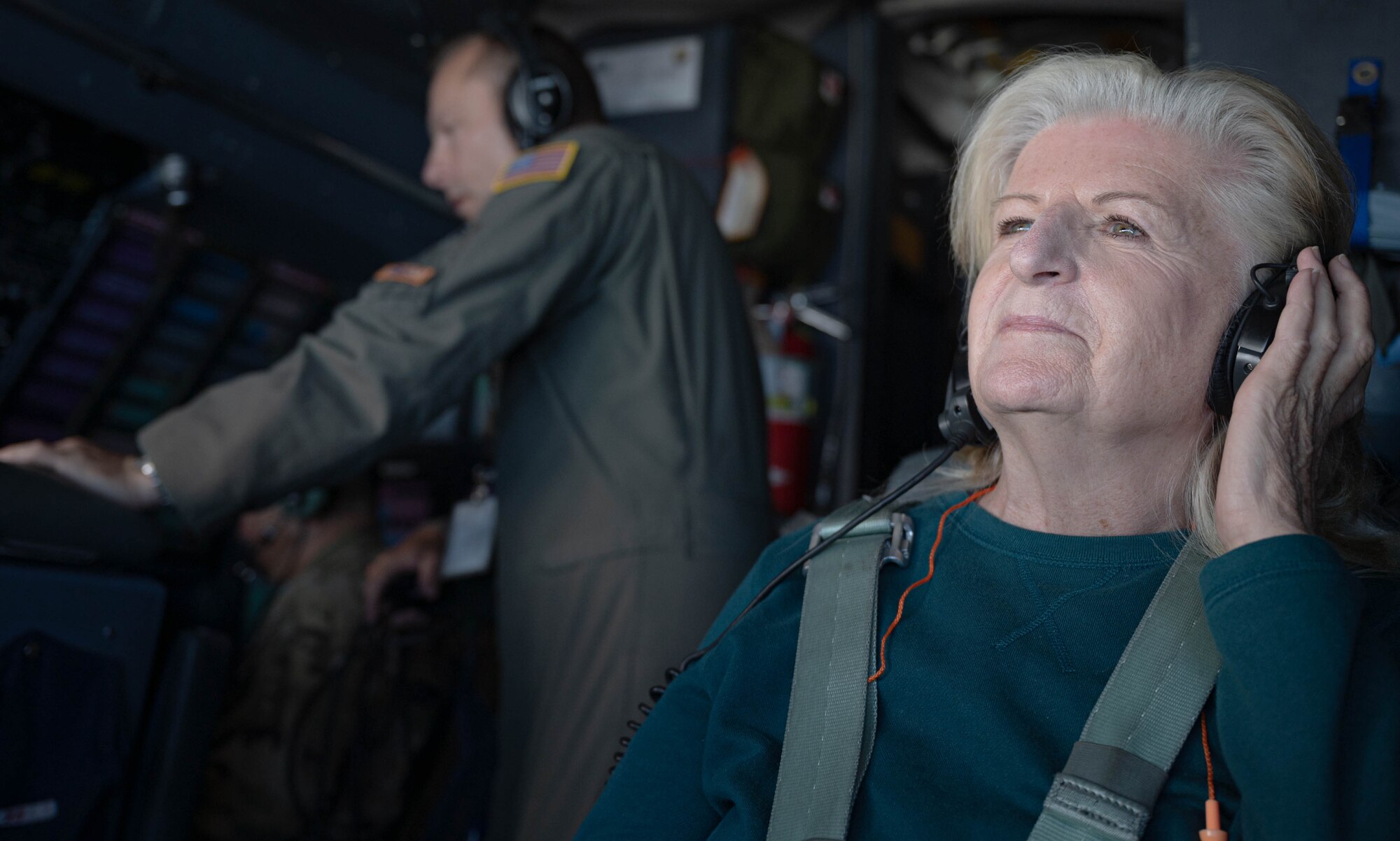 Janie Libby, Dover Air Force Base honorary commander, sits in the navigation seat during an incentive flight on a C-5M Super Galaxy over New York, June 23, 2021. The Dover AFB honorary commanders program encourages an exchange of ideas, experiences and friendships between key members of the local community and Dover AFB. (U.S. Air Force photos by Senior Airman Faith Schaefer)