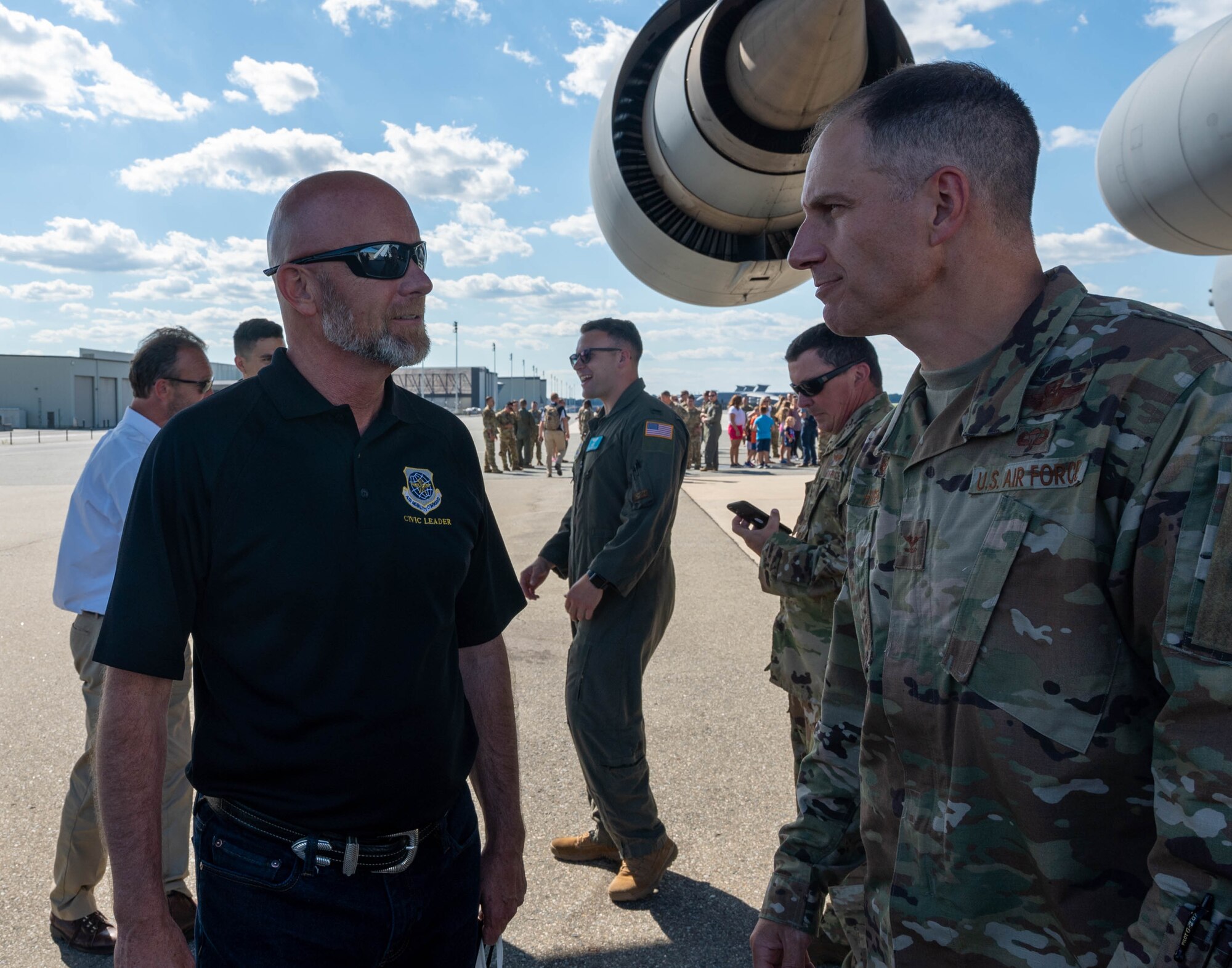 Bobby Pancake, left, Air Mobility Command civic leader, speaks with Col. Matt Husemann, 436th Airlift Wing commander, after an incentive flight on a C-5M Super Galaxy at Dover Air Force Base, Delaware, June 23, 2021. The Dover AFB honorary commanders program encourages an exchange of ideas, experiences and friendships between key members of the local community and Dover AFB. (U.S. Air Force photos by Senior Airman Faith Schaefer)