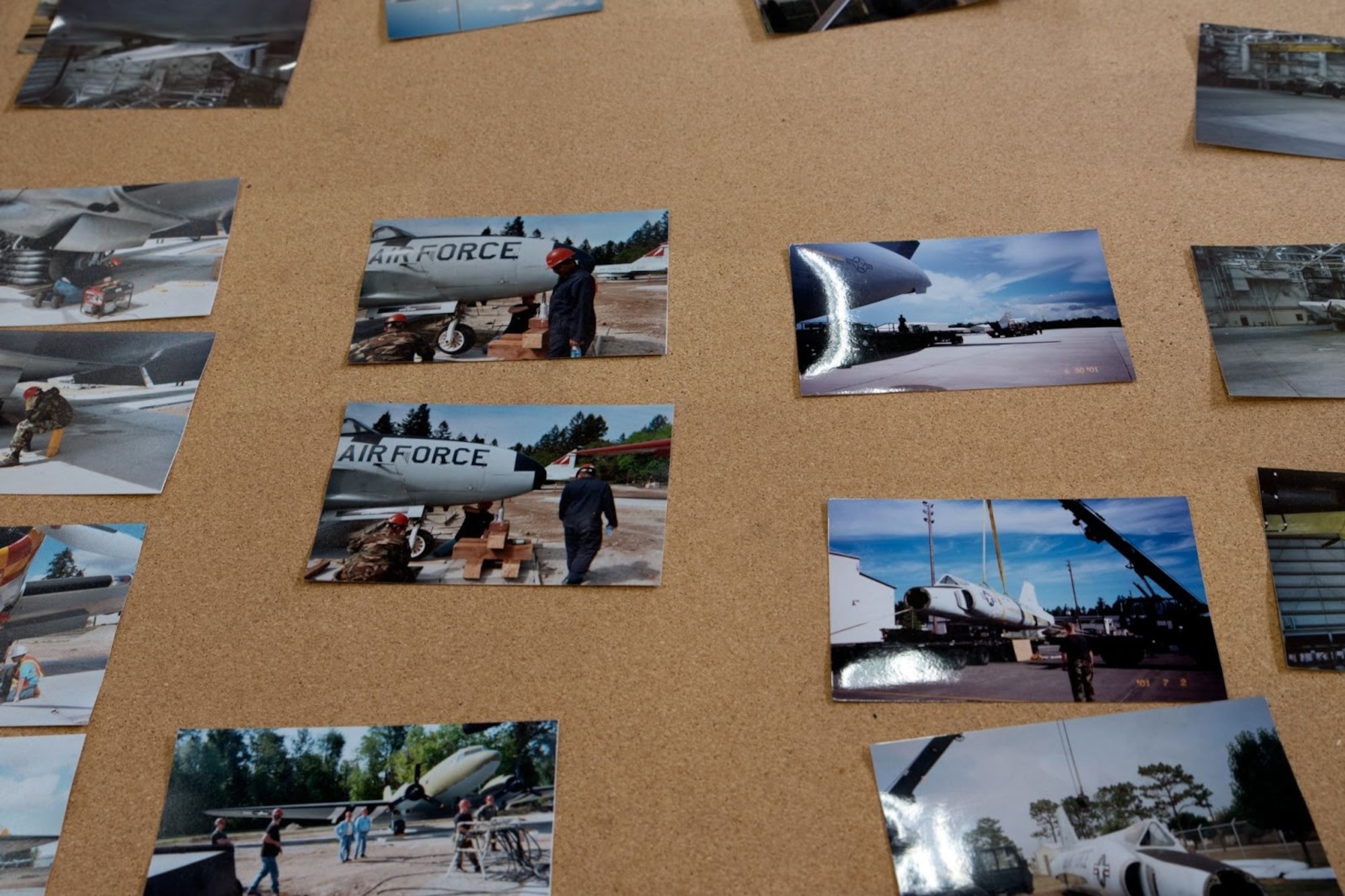 Photos of prior aircraft restoration projects are displayed on a board at Joint Base Lewis-McChord, Washington, June 13, 2021. The McChord Air Museum worked alongside many 62nd Airlift Wing units and volunteers to restore and display a C-130E Hercules aircraft that will be on display at Heritage Hill on McChord Field later this year. (U.S. Air Force photo by Senior Airman Zoe Thacker)