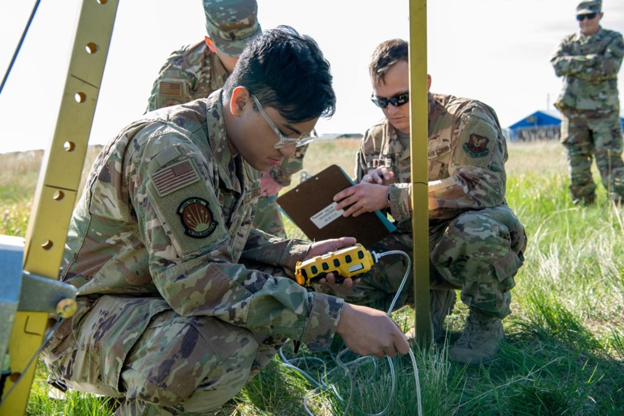 Airman 1st Class Joshua Tabasa, a heavy equipment operator assigned to the 28th Civil Engineer Squadron, tests the air within a confined space to ensure the air is breathable on Ellsworth Air Force, S.D., May 18, 2021.