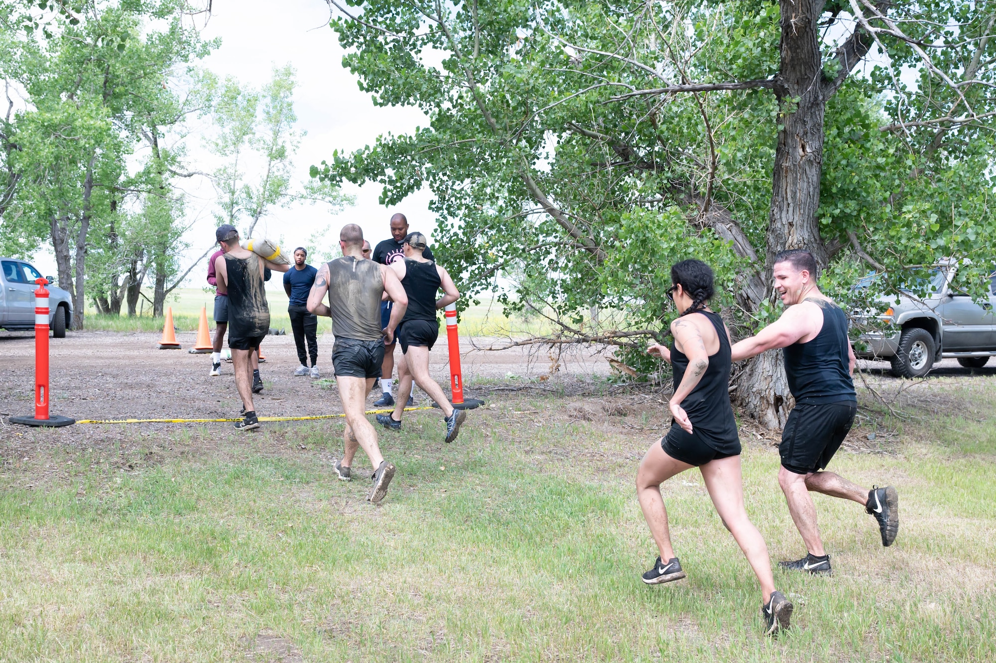 Members of the 341st Missile Wing cross the finish line during the Filthy Mudder race June 25, 2021, at Malmstrom Air Force Base, Mont.