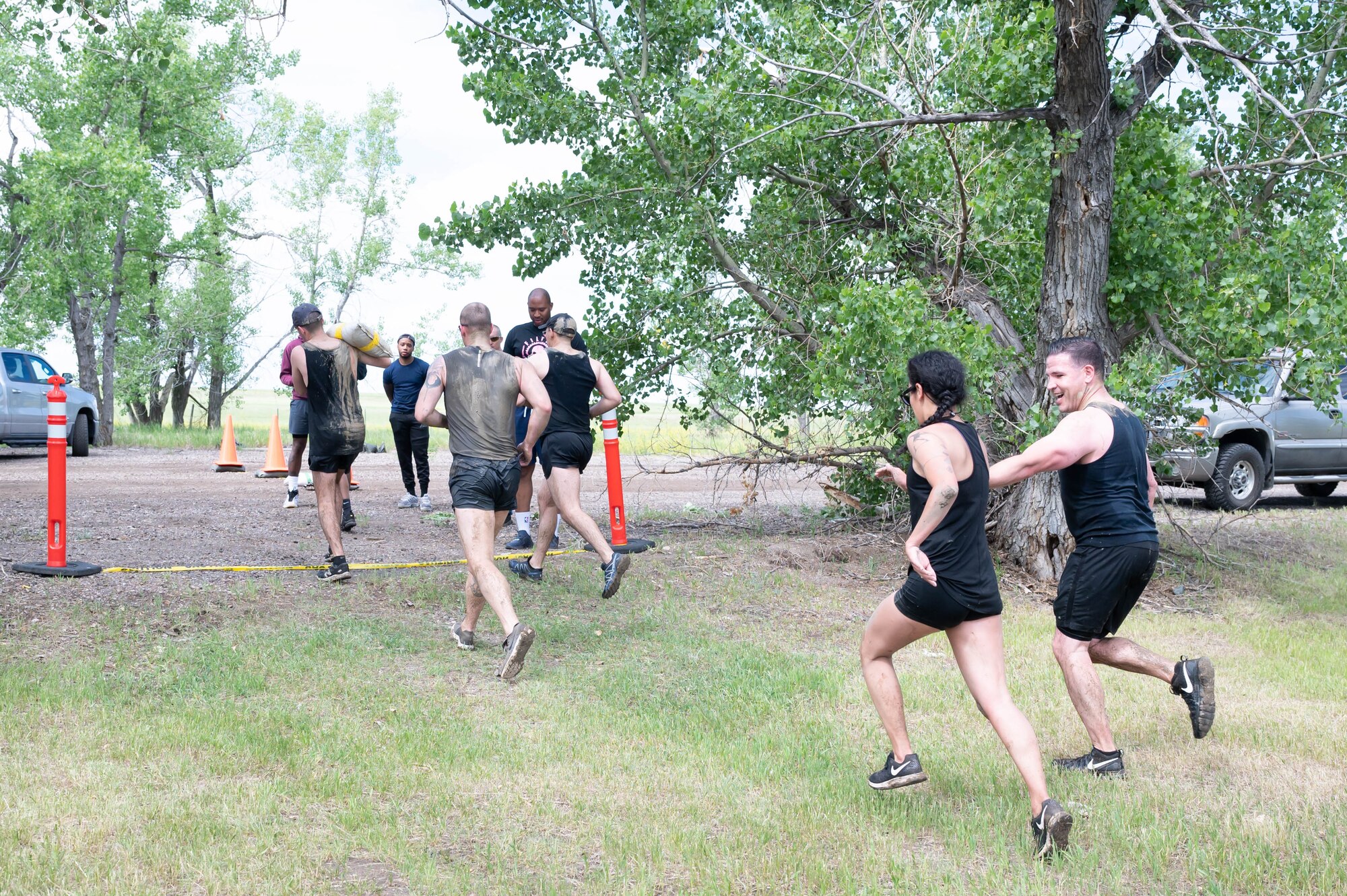 Members of the 341st Missile Wing cross the finish line during the Filthy Mudder race June 25, 2021, at Malmstrom Air Force Base, Mont.