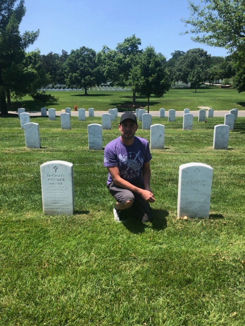 Sergeant Major Clifton Fulkerson visits the graves of two victims of the Khobar Towers bombing at Arlington National Cemetery, June 3, 2019. (Photo provided by Sergeant Major Clifton Fulkerson)