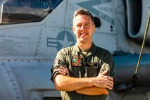 U.S. Marine Corps Capt. Joshua Hazeldean, a Vevay, Indiana native and pilot with Marine Light Attack Helicopter Squadron 367, poses for a picture in front of an AH-1 Super Cobra, Marine Corps Base Hawaii, June 16, 2021. Hazeldean was recently awarded the Alfred A. Cunningham Award, and named 2021 Marine Aviator of the Year.