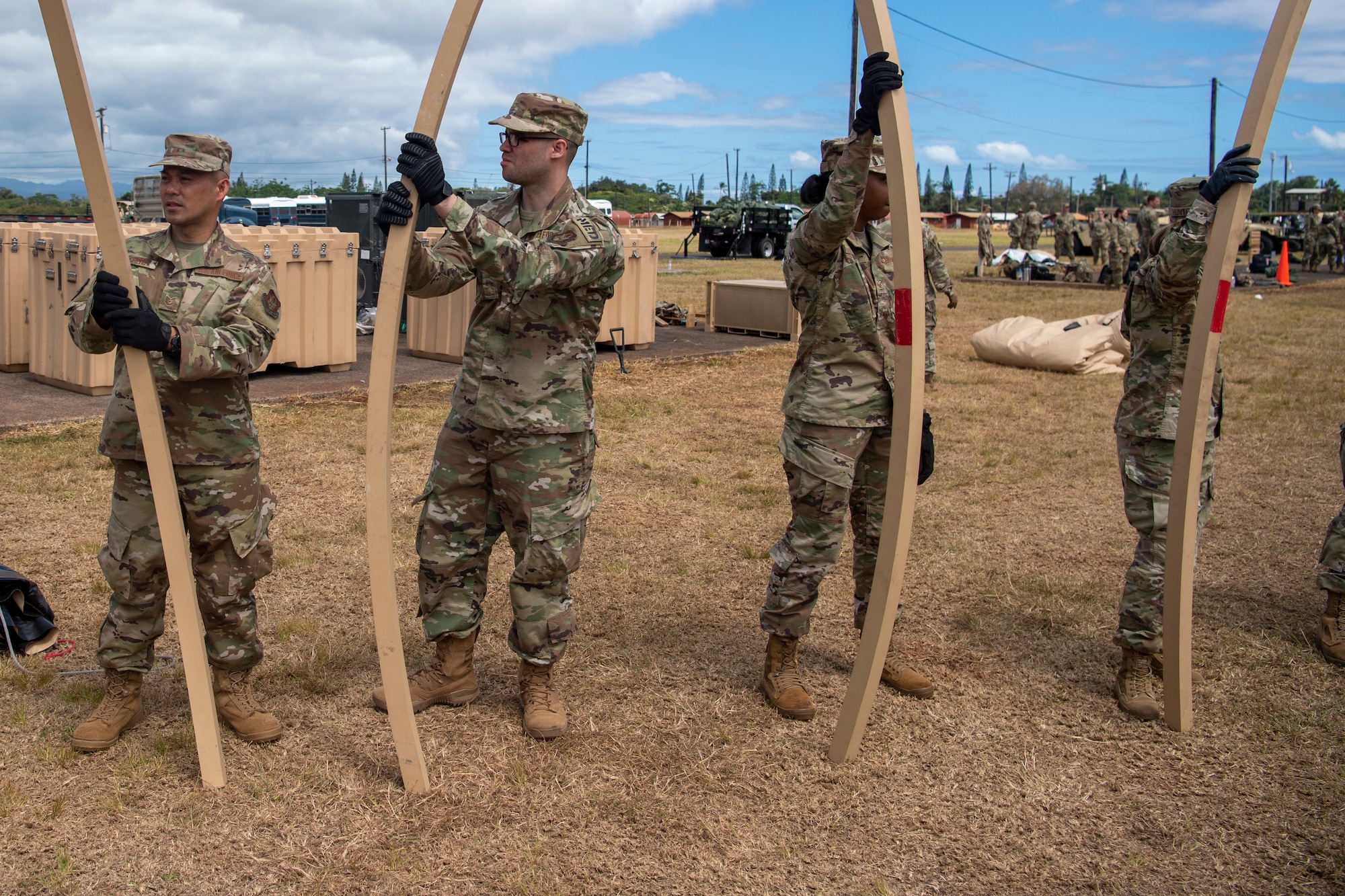 624th Regional Support Group Reserve Citizen Airmen break down Triple S construction tents after a Total Force Integration (TFI) exercise at Schofield Barracks, Hawaii. TFI is a blend of active, Guard, and Reserve personnel working together to accomplish the mission.
