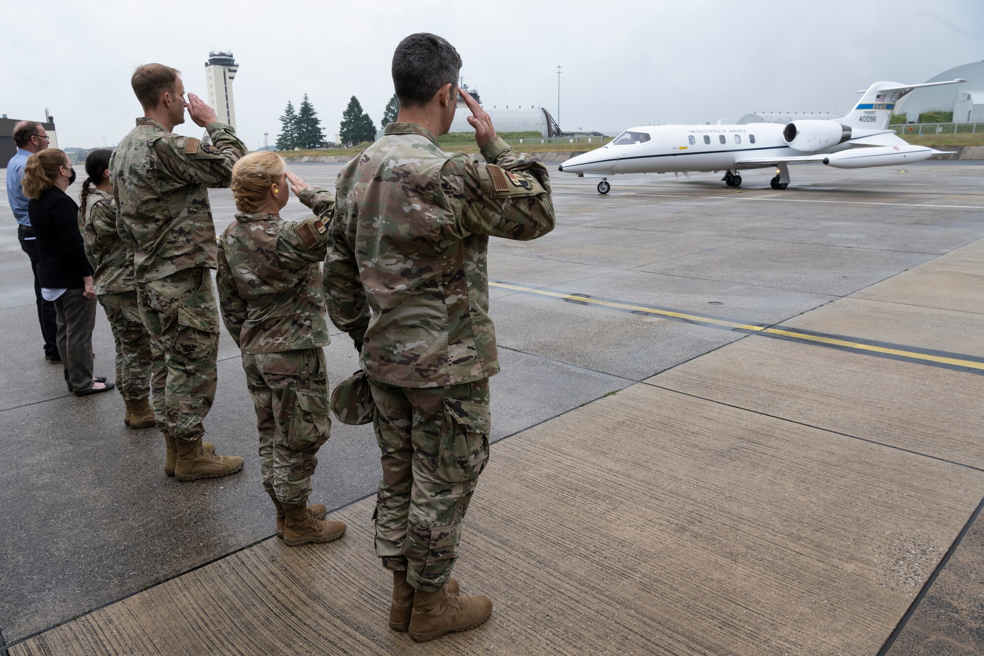 U.S. Air Force leaders from the 52nd Fighter Wing salute farewell to U.S. Air Force Lt. Gen. Steven Basham, U.S. Air Forces in Europe and Air Forces Africa deputy commander.