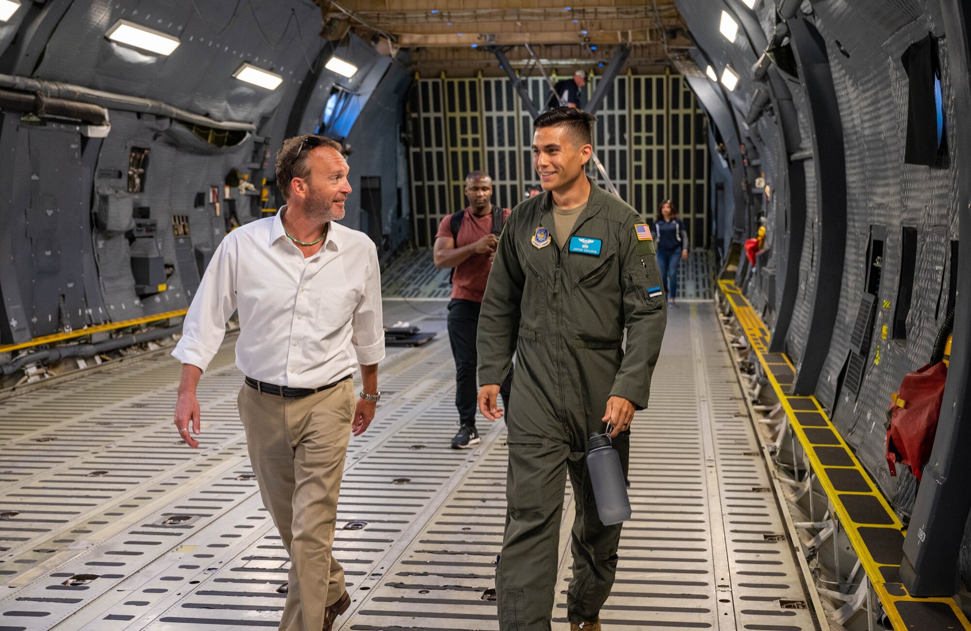 Todd Stonesifer, left, Dover Air Force Base honorary commander, talks to 1st Lt. Jordan Coaliron, 9th Airlift Squadron pilot, while walking in the cargo deck of a C-5M Super Galaxy at Dover AFB, Delaware, June 23, 2021. The Dover AFB honorary commanders program encourages an exchange of ideas, experiences and friendships between key members of the local community and Dover AFB. (U.S. Air Force photos by Senior Airman Faith Schaefer)