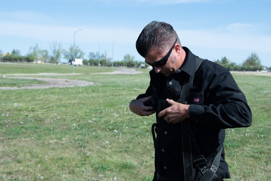 Ken Long, an engineering equipment operator assigned to the 28th Civil Engineer Squadron, prepares to be lowered into a confined space on Ellsworth Air Force Base, S.D., May 18, 2021.