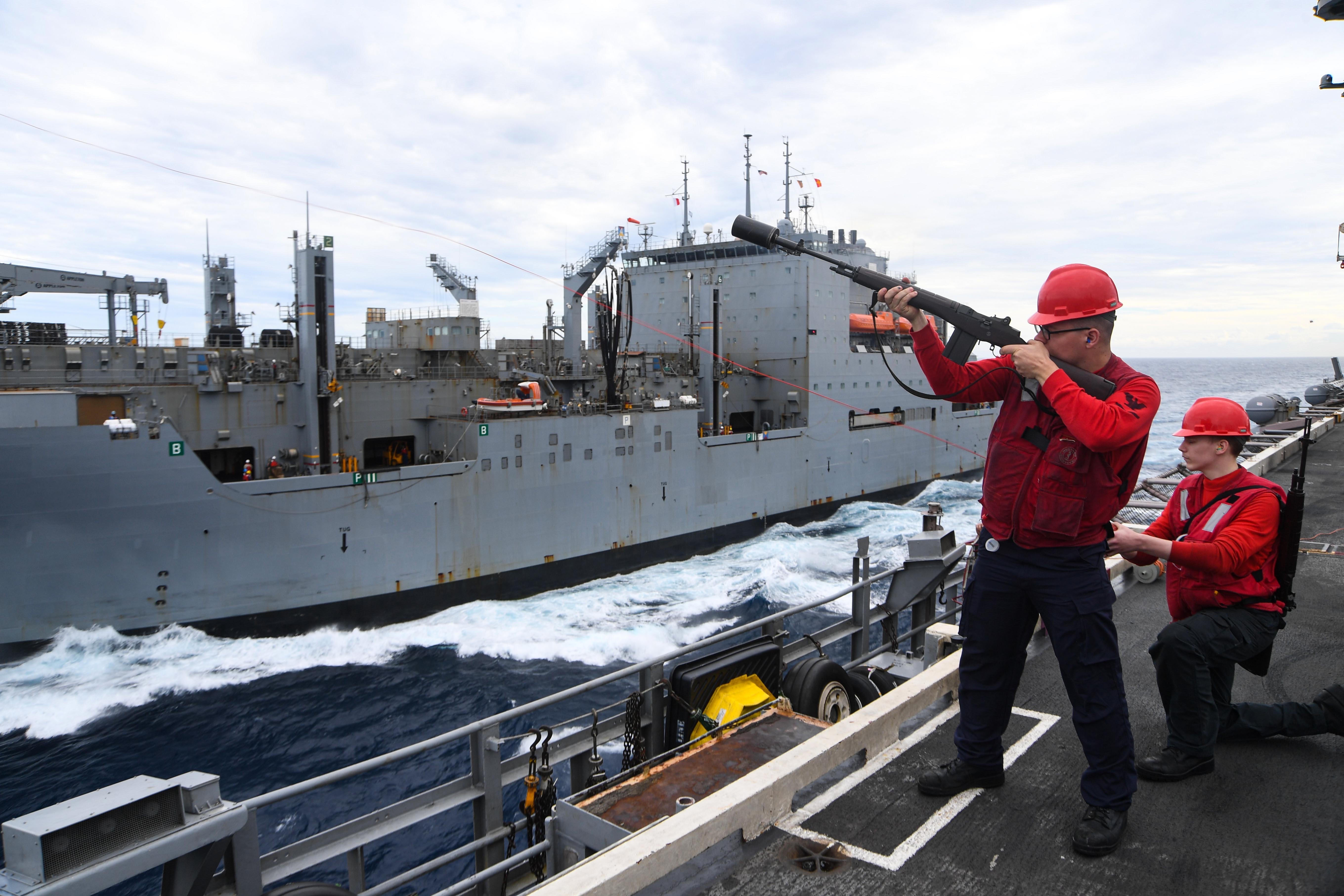 The Nimitz-class aircraft carrier USS Harry S. Truman (CVN 75) during a replenishment-at-sea with the Lewis and Clark-class dry cargo ship USNS Medgar Evers (T-AKE 13).