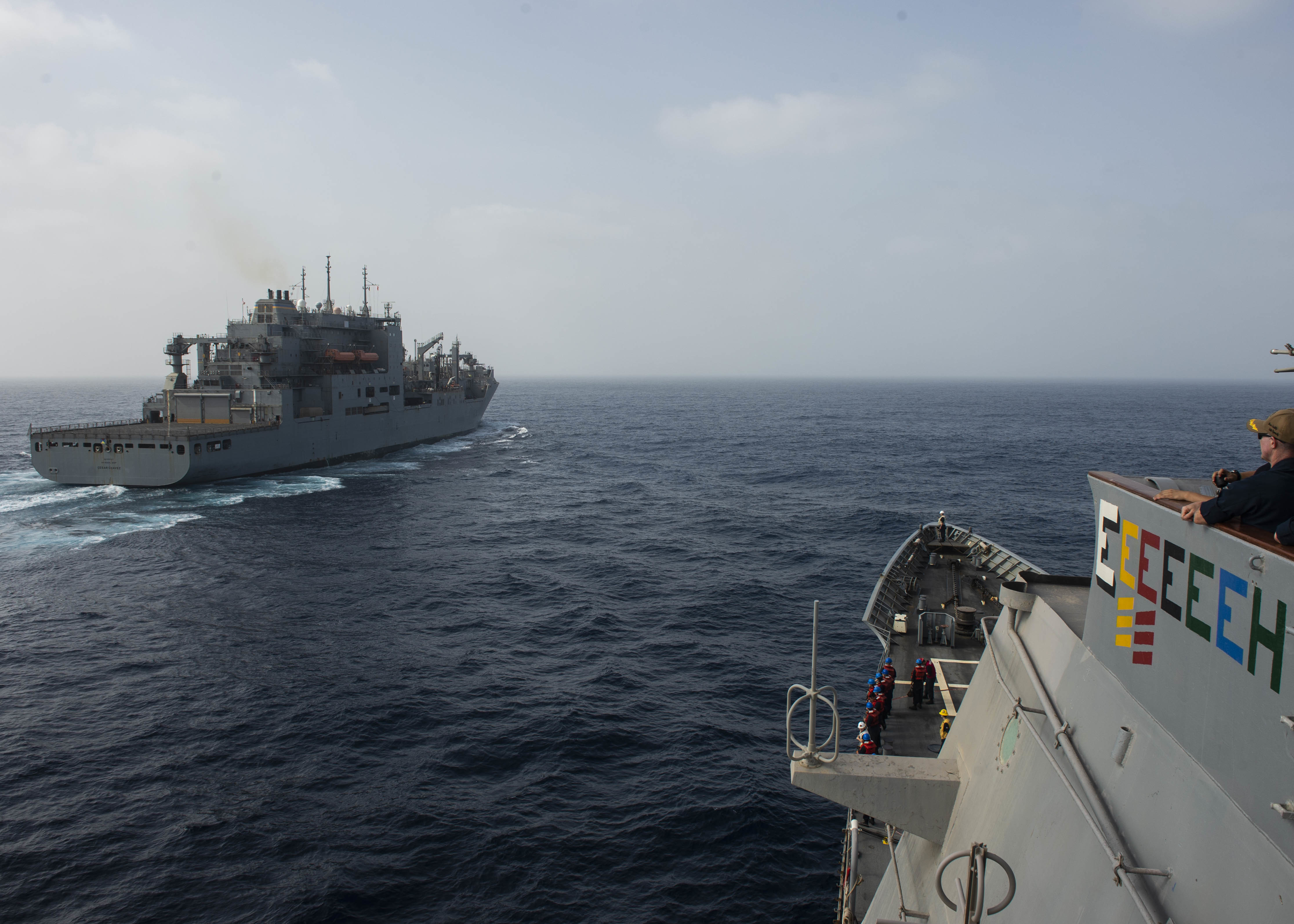 Guided-missile cruiser USS Vella Gulf (CG 72), approaches Military Sealift Command dry cargo and ammunition ship USNS Cesar Chavez (T-AKE 14).