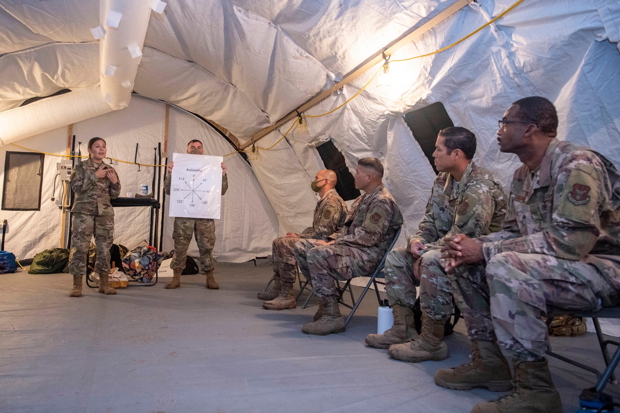 Staff Sgt. Hisela Waipa instructs Reserve Citizen Airmen from the 624th Regional Support Group on land navigation skills during Pacific Warriorz 2021, which is a Total Force Integration and Joint Training exercise at Schofield Barracks, Hawaii June 12, 2021.