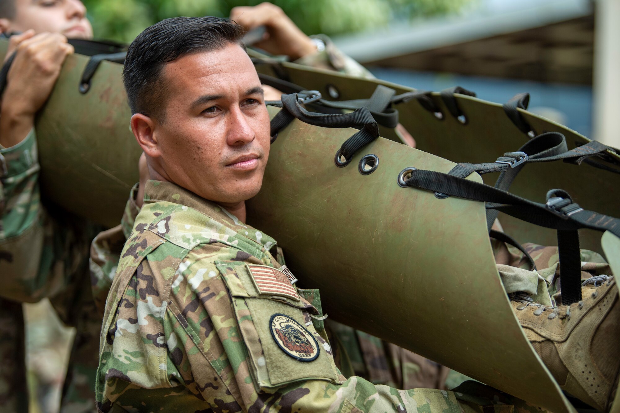 Tech Sgt. Joshua Hayworth, 624th Civil Engineer Squadron is one of a four man team who carries a litter during a Total Force Integration and Joint training exercise at Schofield Barracks, Hawaii June 11, 2021. The leader ensures that all of the bearers act in unison by using preparatory commands.