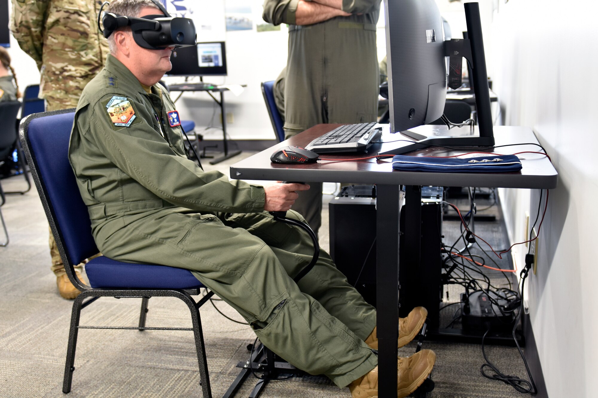 Lt. Gen. Brad Webb, commander of Air Education and Training Command, and Lt. Col. Joseph Davis, 23rd Flying Training Squadron commander, take a closer look at a virtual reality simulator used in Helicopter Training Next. Webb visited the 23rd FTS and provided remarks during the HTN graduation June 22, 2021, at Fort Rucker, Alabama. HTN is one aspect of the AETC Pilot Training Transformation efforts that include Undergraduate Pilot Training 2.5, Accelerated Path to Wings, Remote SIM Instruction, Civil Path to Wings and Alternate Path to Wings.