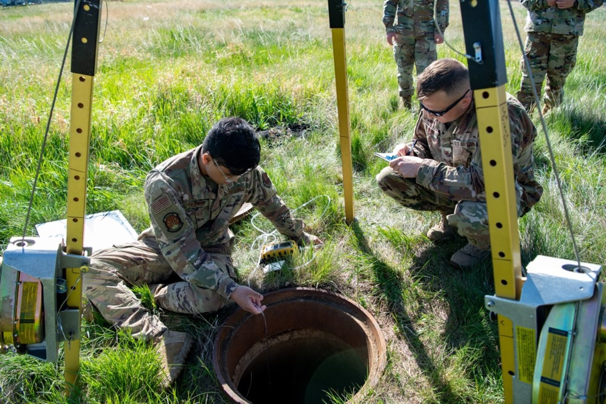 Airman 1st Class Joshua Tabasa, a heavy equipment operator assigned to the 28th Civil Engineer Squadron, tests the air within a confined space to ensure the air is breathable on Ellsworth Air Force Base, S.D., May 18, 2021