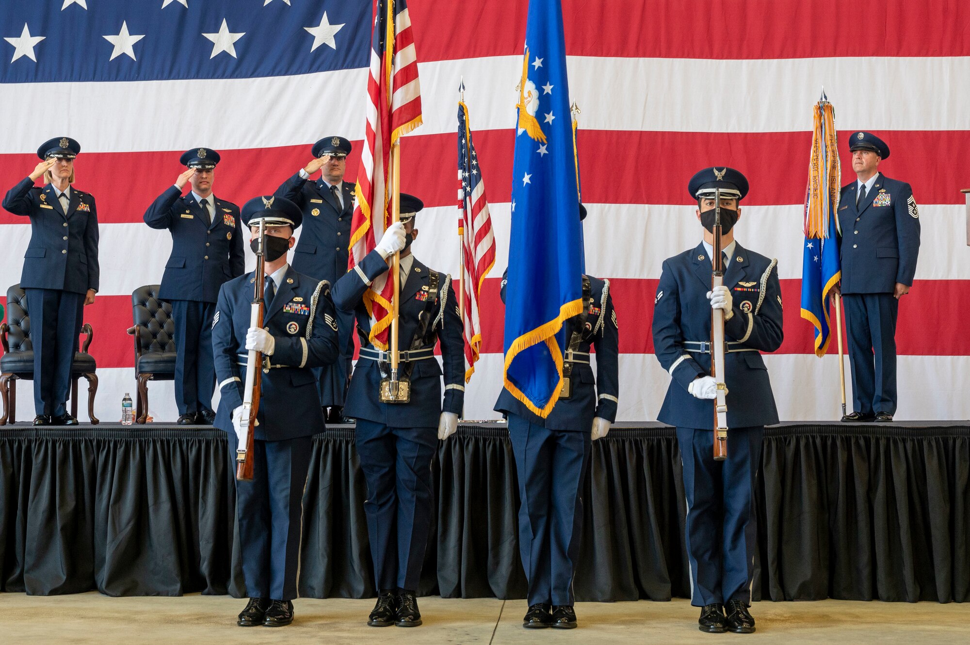 Airmen present the colors during a change of command ceremony.
