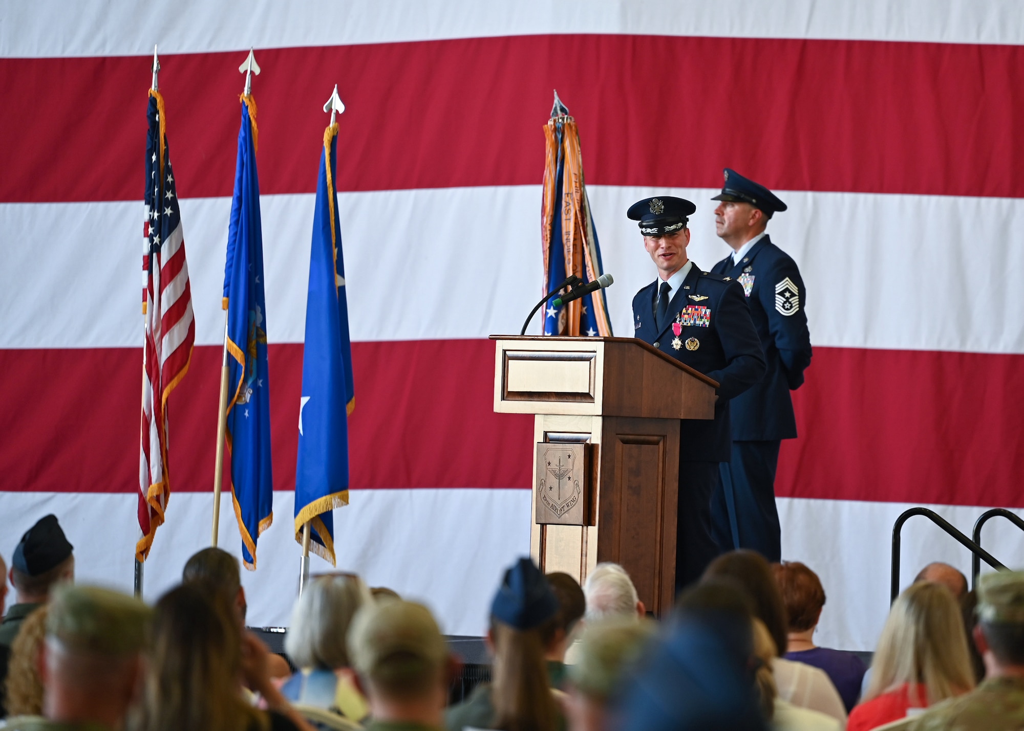 An Airman speaks during a change of command ceremony.