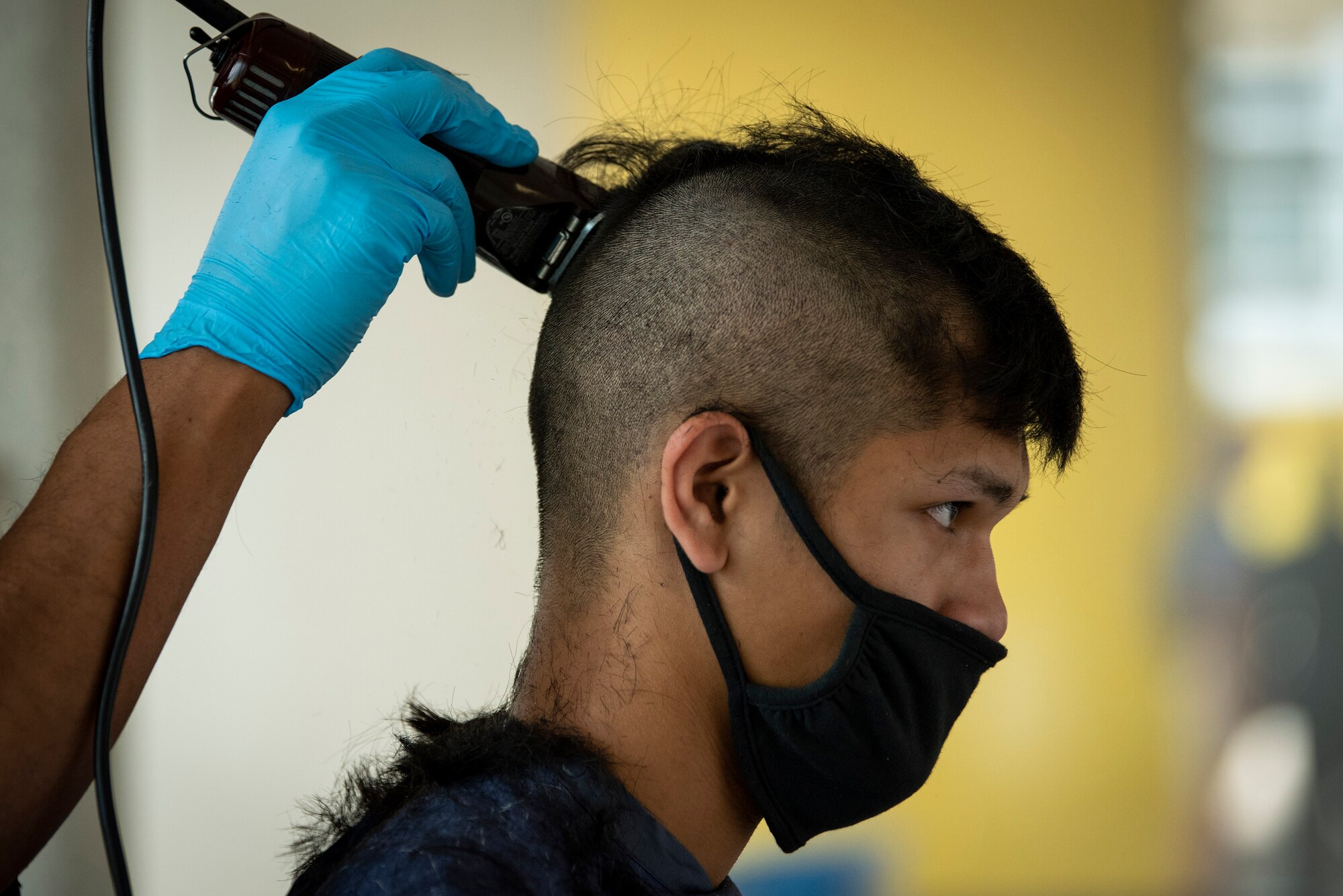 A basic cadet get his first military haircut June 24, 2021 at the start of basic cadet training at the U.S. Air Force Academy.