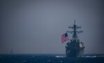 The Arleigh Burke-class guided-missile destroyers USS Ross (DDG 71) and USS Winston S. Churchill (DDG 81) transit the Mediterranean Sea as a helicopter assigned to the French horizon-class frigate Chevalier Paul (D 621) flies overhead Sept. 3, 2018.