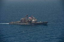 210608-N-RG587-1075 ARABIAN GULF (June 8, 2021)  Guided-missile cruiser USS Vella Gulf (CG 72), transits the Arabian Gulf during exercise Eager Defender 21, June 8. Eager Defender 21 is the capstone in a series of bilateral exercises between Kuwait and U.S. naval forces, focused on enhancing mutual capabilities and interoperability in maritime security operations. (U.S. Navy photo by Mass Communication Specialist 2nd Class Dean M. Cates)