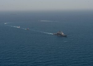 210608-N-RG587-1336 ARABIAN GULF (June 8, 2021) Guided-missile cruiser USS Vella Gulf (CG 72), patrol coastal ship USS Thunderbolt (PC 12), Coast Guard patrol boat USCGC Monomoy (WPB 1326), and Kuwait Navy patrol boats KNS Istiqlal (P5702) and KNS Al-Garoh (P3725), operate in formation during Eager Defender 21 in the Arabian Gulf, June 8. Eager Defender 21 is the capstone in a series of bilateral exercises between Kuwait and U.S. naval forces, focused on enhancing mutual capabilities and interoperability in maritime security operations. (U.S. Navy photo by Mass Communication Specialist 2nd Class Dean M. Cates)