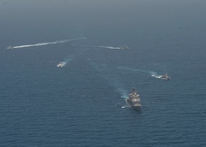 210608-N-RG587-1423 ARABIAN GULF (June 8, 2021) Guided-missile cruiser USS Vella Gulf (CG 72), patrol coastal ship USS Thunderbolt (PC 12), Coast Guard patrol boat USCGC Monomoy (WPB 1326), and Kuwait Navy patrol boats KNS Istiqlal (P5702) and KNS Al-Garoh (P3725), operate in formation during Eager Defender 21 in the Arabian Gulf, June 8. Eager Defender 21 is the capstone in a series of bilateral exercises between Kuwait and U.S. naval forces, focused on enhancing mutual capabilities and interoperability in maritime security operations. (U.S. Navy photo by Mass Communication Specialist 2nd Class Dean M. Cates)