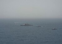 210608-N-RG587-1726 ARABIAN GULF (June 8, 2021) Guided-missile cruiser USS Vella Gulf (CG 72), patrol coastal ship USS Thunderbolt (PC 12), Coast Guard patrol boat USCGC Monomoy (WPB 1326), and Kuwait Navy patrol boats KNS Istiqlal (P5702) and KNS Al-Garoh (P3725), operate in formation during Eager Defender 21 in the Arabian Gulf, June 8. Eager Defender 21 is the capstone in a series of bilateral exercises between Kuwait and U.S. naval forces, focused on enhancing mutual capabilities and interoperability in maritime security operations. (U.S. Navy photo by Mass Communication Specialist 2nd Class Dean M. Cates)
