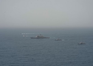 210608-N-RG587-1726 ARABIAN GULF (June 8, 2021) Guided-missile cruiser USS Vella Gulf (CG 72), patrol coastal ship USS Thunderbolt (PC 12), Coast Guard patrol boat USCGC Monomoy (WPB 1326), and Kuwait Navy patrol boats KNS Istiqlal (P5702) and KNS Al-Garoh (P3725), operate in formation during Eager Defender 21 in the Arabian Gulf, June 8. Eager Defender 21 is the capstone in a series of bilateral exercises between Kuwait and U.S. naval forces, focused on enhancing mutual capabilities and interoperability in maritime security operations. (U.S. Navy photo by Mass Communication Specialist 2nd Class Dean M. Cates)