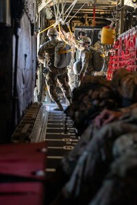 U.S. Army Soldiers with 301st Tactical Psychological Operations, PSYOP, Company (Airborne),14th PSYOP Battalion, 7th PSYOP Group, jump out of a U.S. Air Force KC-130 Hercules during a static-line jump exercise at Naval Base Coronado, California, June 11, 2021. The 301st TCP invited I Marine Expeditionary Force Information Group PSYOP Marines to observe jump training before attending the U.S. Army Airborne school. Gaining jump qualifications enables I MIG to effectively integrate and support I Marine Expeditionary Force information operations in forward deployed environments.