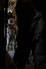 A U.S. Air Force crew chief checks for an all clear during a U.S. Air Force KC-130 Hercules static-line jump exercise at Naval Base Coronado, California, June 11, 2021. The 301st TCP invited I Marine Expeditionary Force Information Group PSYOP Marines to observe jump training before attending the U.S. Army Airborne school. Gaining jump qualifications enables I MIG to effectively integrate and support I Marine Expeditionary Force information operations in forward deployed environments.