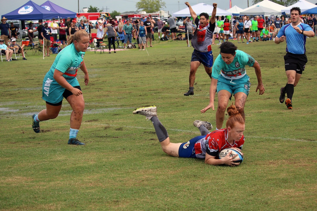 Air Force MSgt Sahtara Wehe of Spangdahlem AB, Germany crosses the try-line against Navy during the 2021 Armed Forces Rugby Championship held in conjunction with the 2021 Cape Fear Rugby Sevens Tournament, held from 24-28 June.  Service members from the Army, Marine Corps, Navy, Air Force (with Space Force personnel) and Coast Guard battle it out for gold.  (Department of Defense Photo, Released)