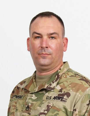 Far East District Commander, COL Christopher Crary, presents SSG Timothy Sepkoski, Southern Resident Office Quality Assurance Rep, with an end-of-service award. Upon separation from the Army, Sepkoski will join SRO as a Civilian.