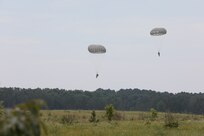 U.S. Army Reserve paratroopers with the U.S. Army Civil Affairs and Psychological Operations Command (Airborne) navigate to a landing during nontactical airborne operations at Saint Mere Eglise drop zone, Fort Bragg, N.C., June 5, 2021. USACAPOC(A) jumpmasters worked with Capt. Ignacio Rios, a Chilean jumpmaster assigned to the 1st Special Warfare Training Group(A), U.S. Army John F. Kennedy Special Warfare Center and School (USAJFKSWCS). Paratroopers jumping during the airborne operations were eligible to earn foreign wings