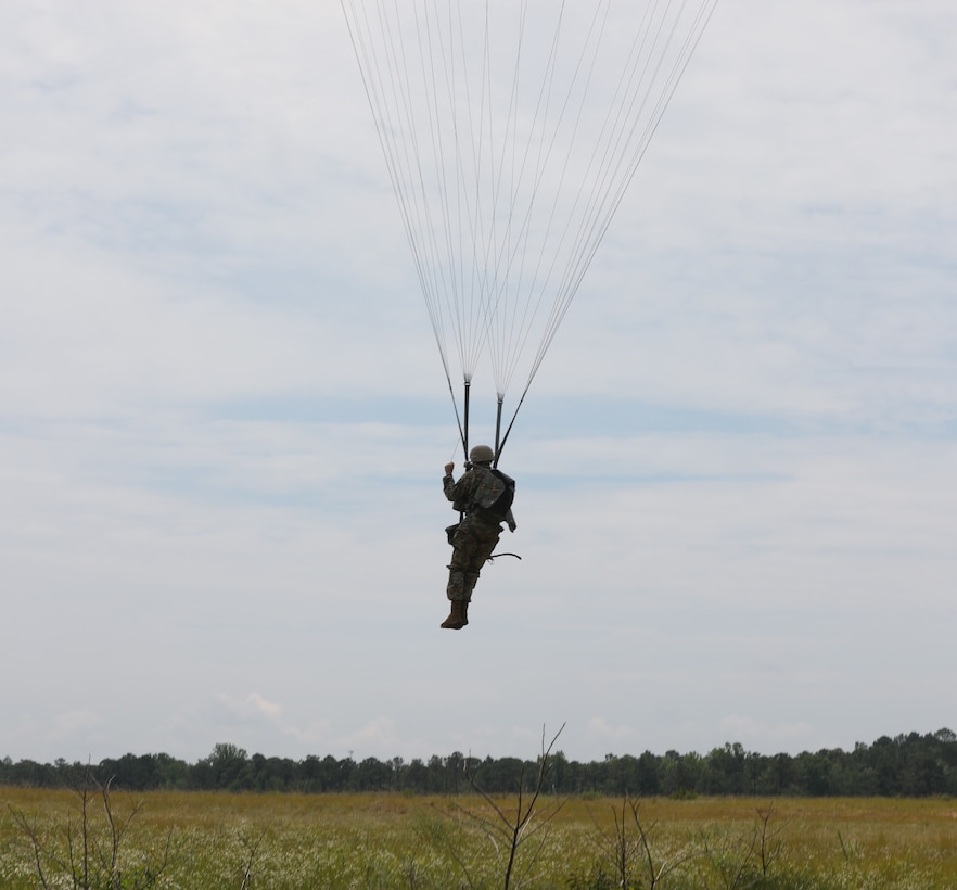 A U.S. Army Reserve paratrooper with the U.S. Army Civil Affairs and Psychological Operations Command (Airborne) navigates to a landing during nontactical airborne operations at Saint Mere Eglise drop zone, Fort Bragg, N.C., June 5, 2021. USACAPOC(A) jumpmasters worked with Capt. Ignacio Rios, a Chilean jumpmaster assigned to the 1st Special Warfare Training Group(A), U.S. Army John F. Kennedy Special Warfare Center and School (USAJFKSWCS). Paratroopers jumping during the airborne operations were eligible to earn foreign wings.
