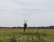 A U.S. Army Reserve paratrooper with the U.S. Army Civil Affairs and Psychological Operations Command (Airborne) navigates to a landing during nontactical airborne operations at Saint Mere Eglise drop zone, Fort Bragg, N.C., June 5, 2021. USACAPOC(A) jumpmasters worked with Capt. Ignacio Rios, a Chilean jumpmaster assigned to the 1st Special Warfare Training Group(A), U.S. Army John F. Kennedy Special Warfare Center and School (USAJFKSWCS). Paratroopers jumping during the airborne operations were eligible to earn foreign wings.