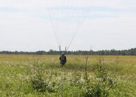 A U.S. Army Reserve paratrooper with the U.S. Army Civil Affairs and Psychological Operations Command (Airborne) navigates to a landing during nontactical airborne operations at Saint Mere Eglise drop zone, Fort Bragg, N.C., June 5, 2021. USACAPOC(A) jumpmasters worked with Capt. Ignacio Rios, a Chilean jumpmaster assigned to the 1st Special Warfare Training Group(A), U.S. Army John F. Kennedy Special Warfare Center and School (USAJFKSWCS). Paratroopers jumping during the airborne operations were eligible to earn foreign wings.