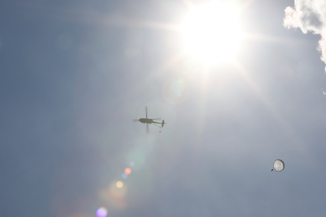 A U.S. Army Reserve paratrooper with the U.S. Army Civil Affairs and Psychological Operations Command (Airborne) conducts nontactical airborne operations from a UH-60 Black Hawk helicopter at Saint Mere Eglise drop zone, Fort Bragg, N.C., June 5, 2021. USACAPOC(A) jumpmasters worked with Capt. Ignacio Rios, a Chilean jumpmaster assigned to the 1st Special Warfare Training Group(A), U.S. Army John F. Kennedy Special Warfare Center and School (USAJFKSWCS). Paratroopers jumping during the airborne operations were eligible to earn foreign wings.